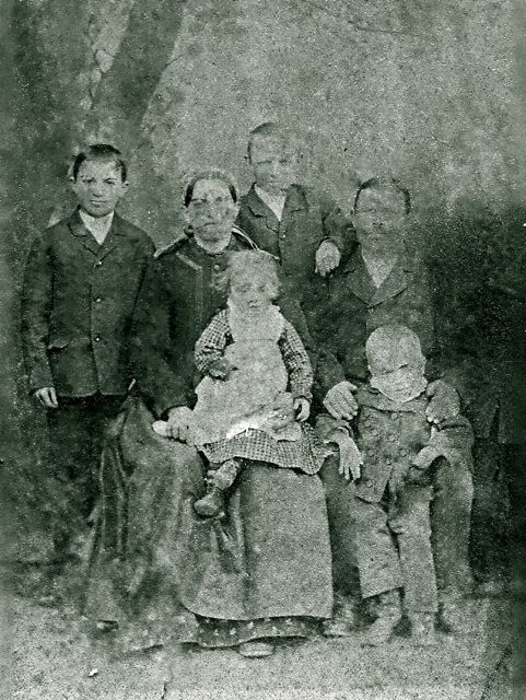 Johannes Roth Family (1886)
Johannes Roth, wife Anna Shuster, and 4 of their children, Matyas, Robert (standing), Maria, & Adolph. Their son John is actually in the picture on the right but has faded out except for his feet and legs.